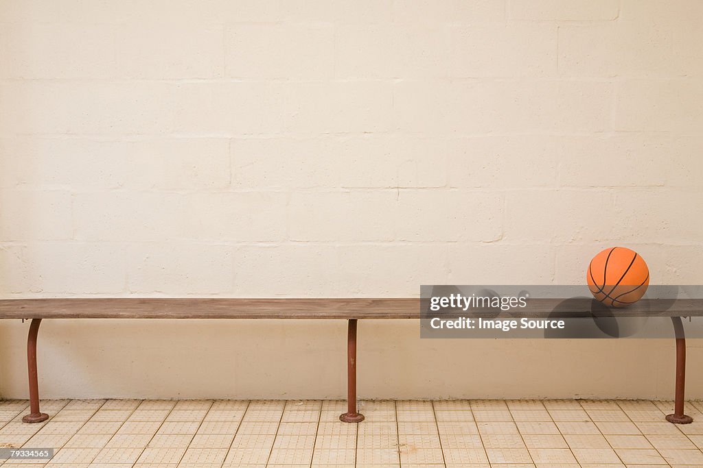 A basketball on a bench