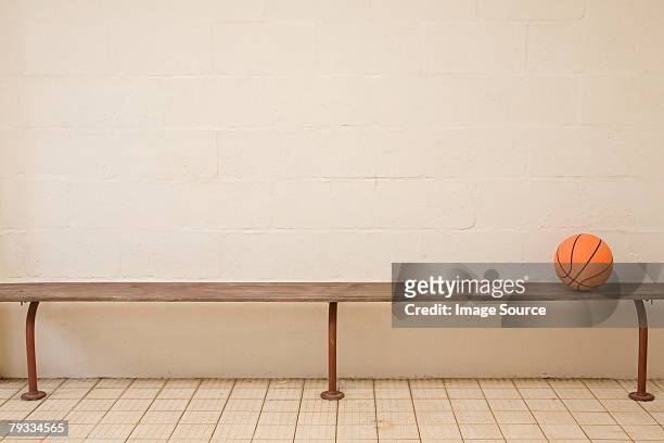 a basketball on a bench - basketball bench stock pictures, royalty-free photos & images