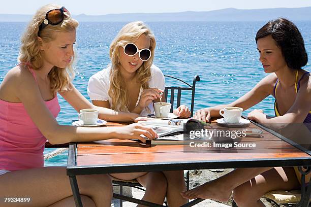 young women by the sea - brac island stock pictures, royalty-free photos & images