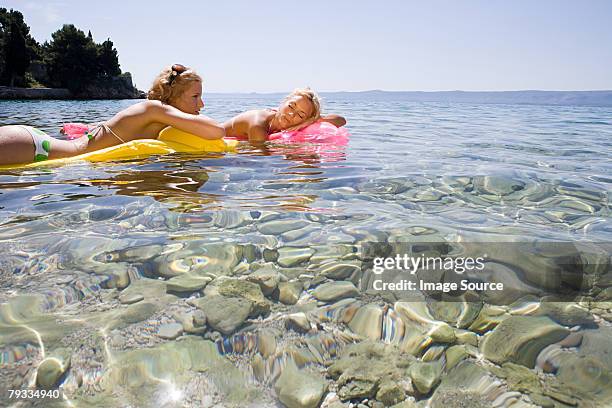 young women relaxing in the sea - brac croatia stock pictures, royalty-free photos & images