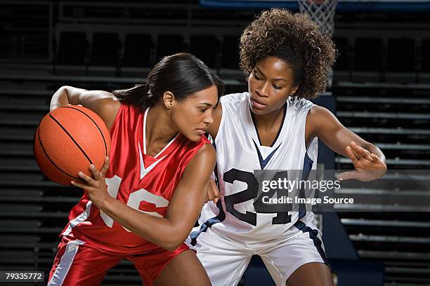 female basketball players - basketball jersey stock pictures, royalty-free photos & images