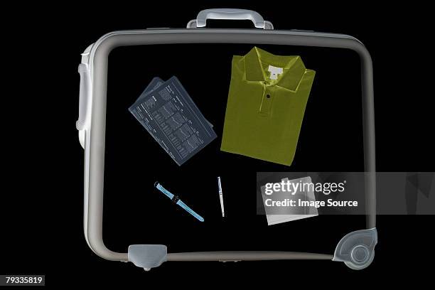 x ray of objects in suitcase - airport x ray images stock pictures, royalty-free photos & images
