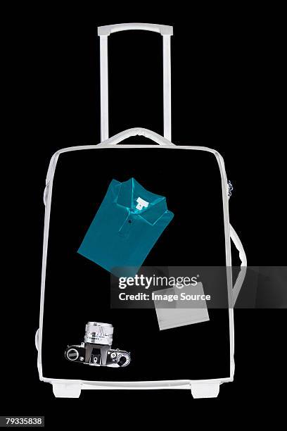x ray of objects in suitcase - airport x ray images stock pictures, royalty-free photos & images