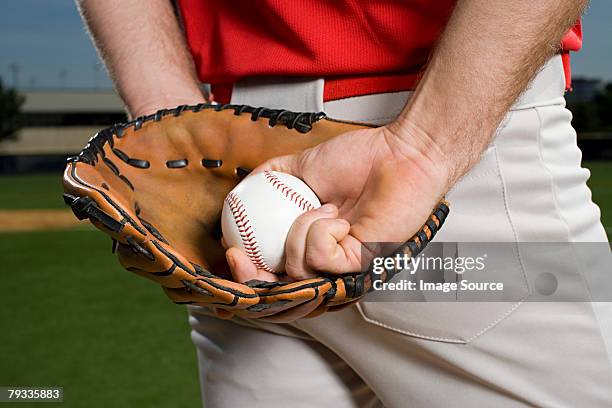 baseball pitcher with glove and ball - baseball pitcher stock pictures, royalty-free photos & images