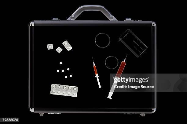 tablets and syringes in briefcase - airport x ray images stock pictures, royalty-free photos & images