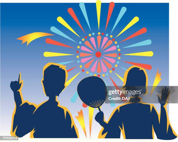 two young people watching fireworks, night, rear view - asian man back stock illustrations
