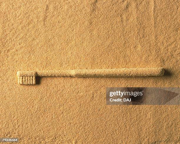 sand craft of toothbrush, high angle view, copy space - dentifrice stockfoto's en -beelden