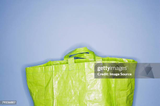 a reusable plastic bag - reusable bag stock pictures, royalty-free photos & images