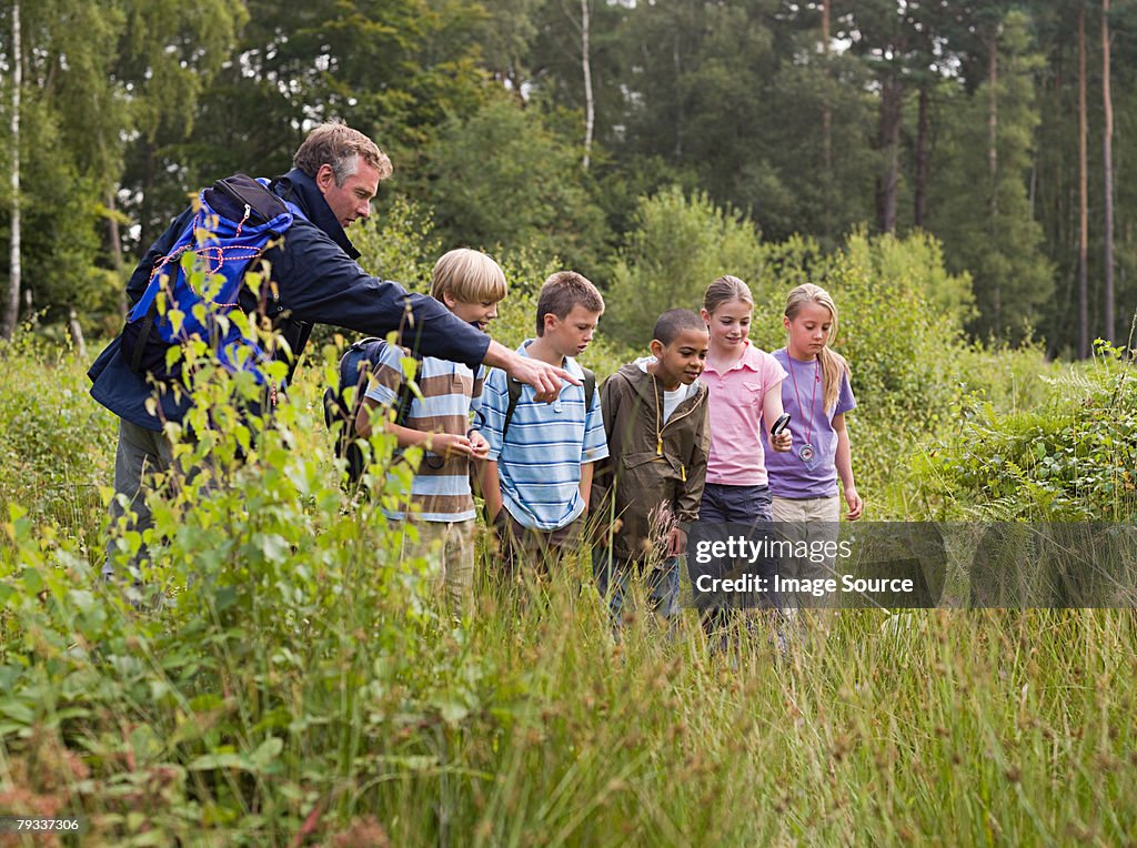 Teacher and pupils at nature reserve