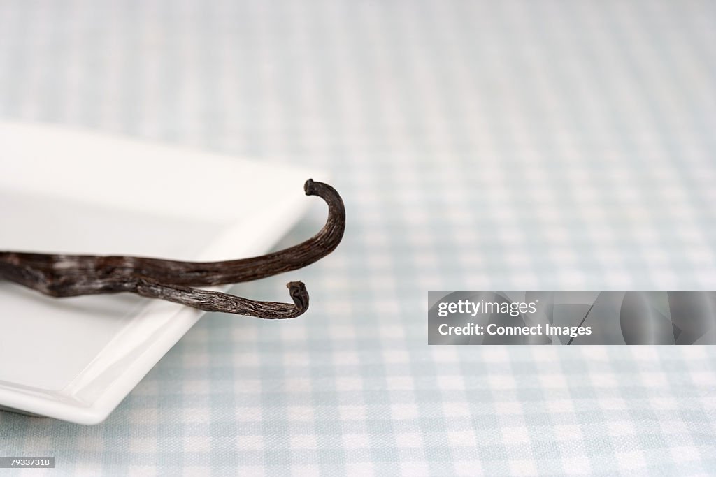 Vanilla bean is on a dish