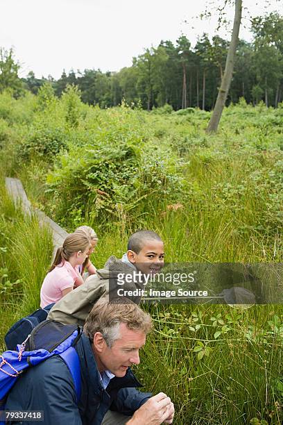 teacher and pupils on field trip - portrait of school children and female teacher in field stock pictures, royalty-free photos & images