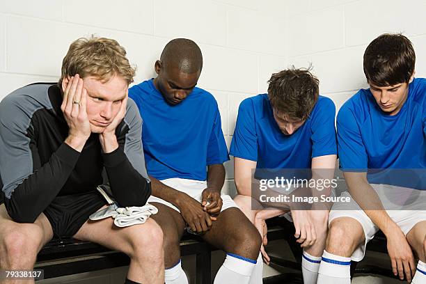 a disppointed football team - bad goalkeeper stock pictures, royalty-free photos & images