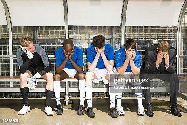 football manager and team with head in hands - subdue stock pictures, royalty-free photos & images