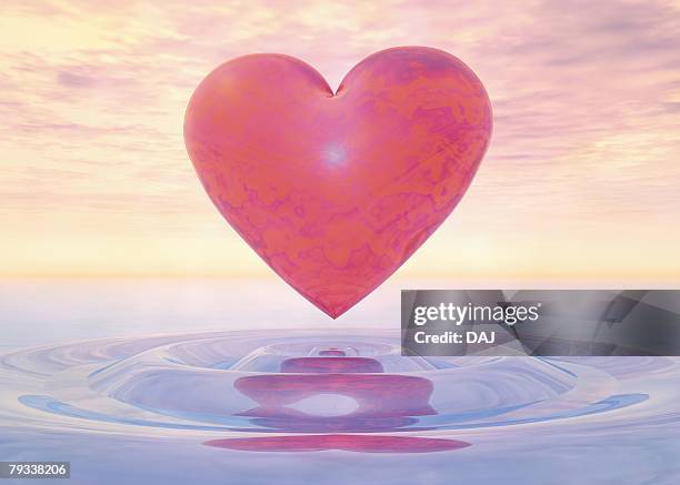glossy heart floating on water, cg, 3d, illustration, low angle view - low angle sky stock illustrations