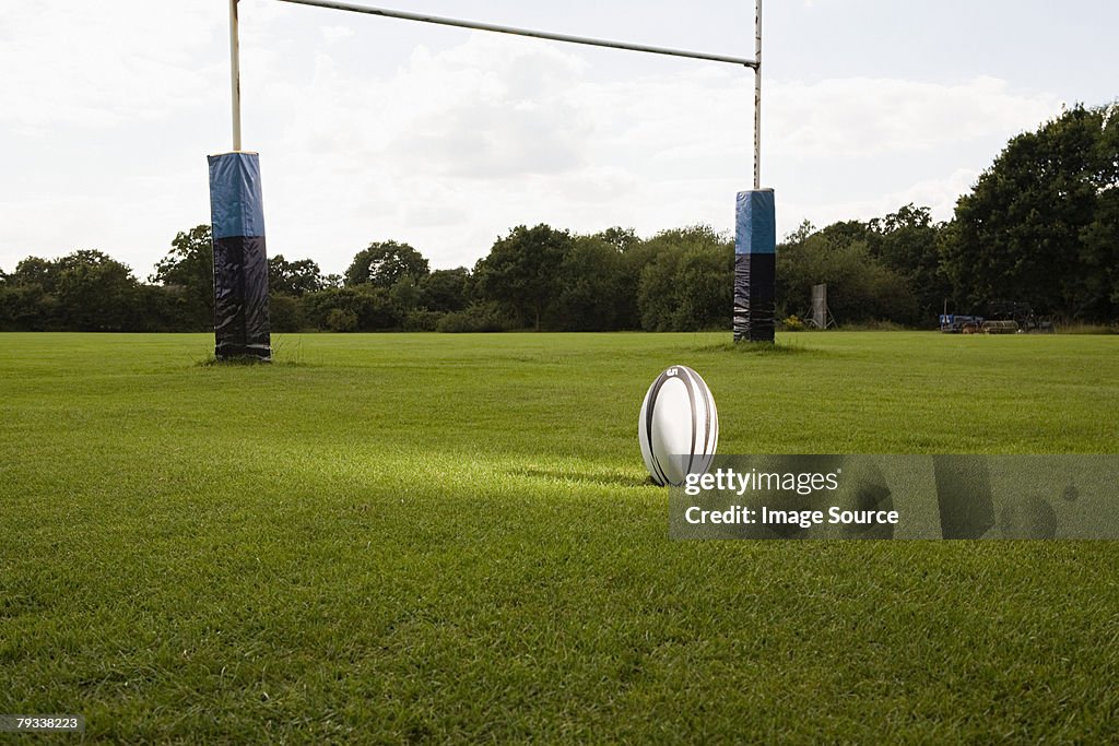An illuminated rugby ball on a rugby pitch