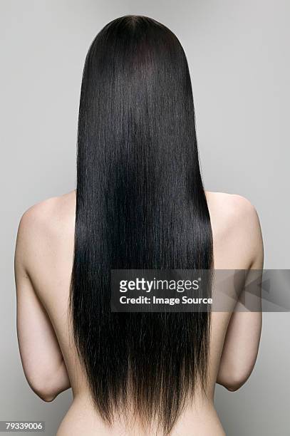 rear view of a woman - long hair stock pictures, royalty-free photos & images