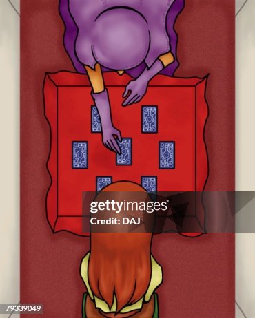 Tarot card reader telling the fortune, high angle view Tarot card reader telling the fortune, high angle view