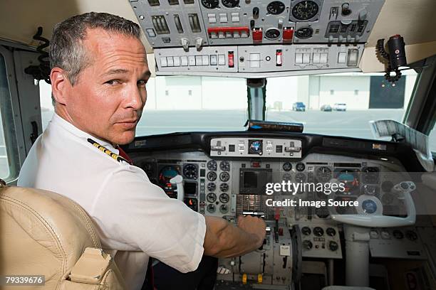 pilot in cockpit - captains stock pictures, royalty-free photos & images