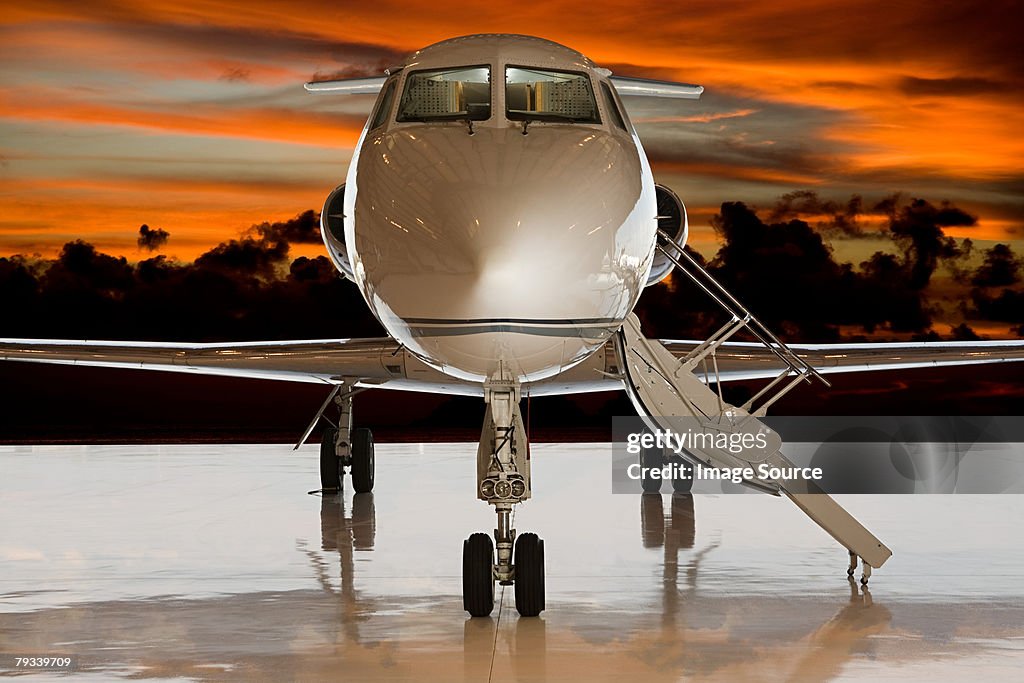 Private airplane at sunset