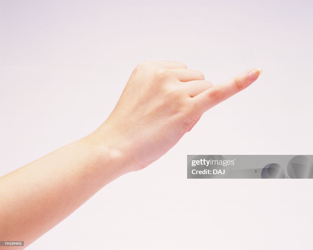 Woman putting her pinkie out