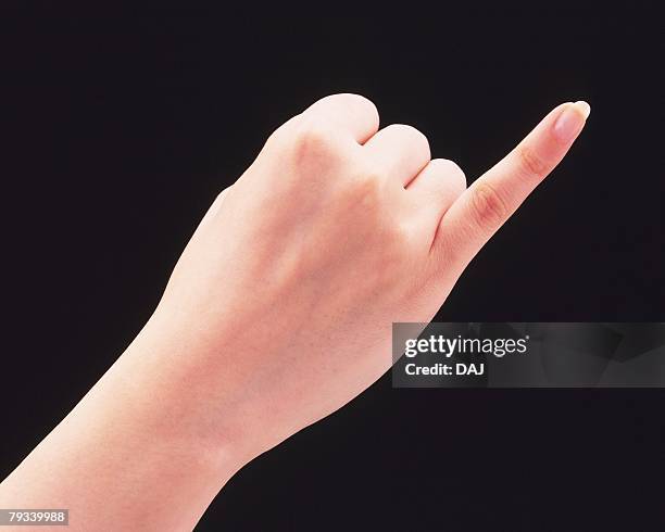 woman putting her pinkie out - little finger stock pictures, royalty-free photos & images