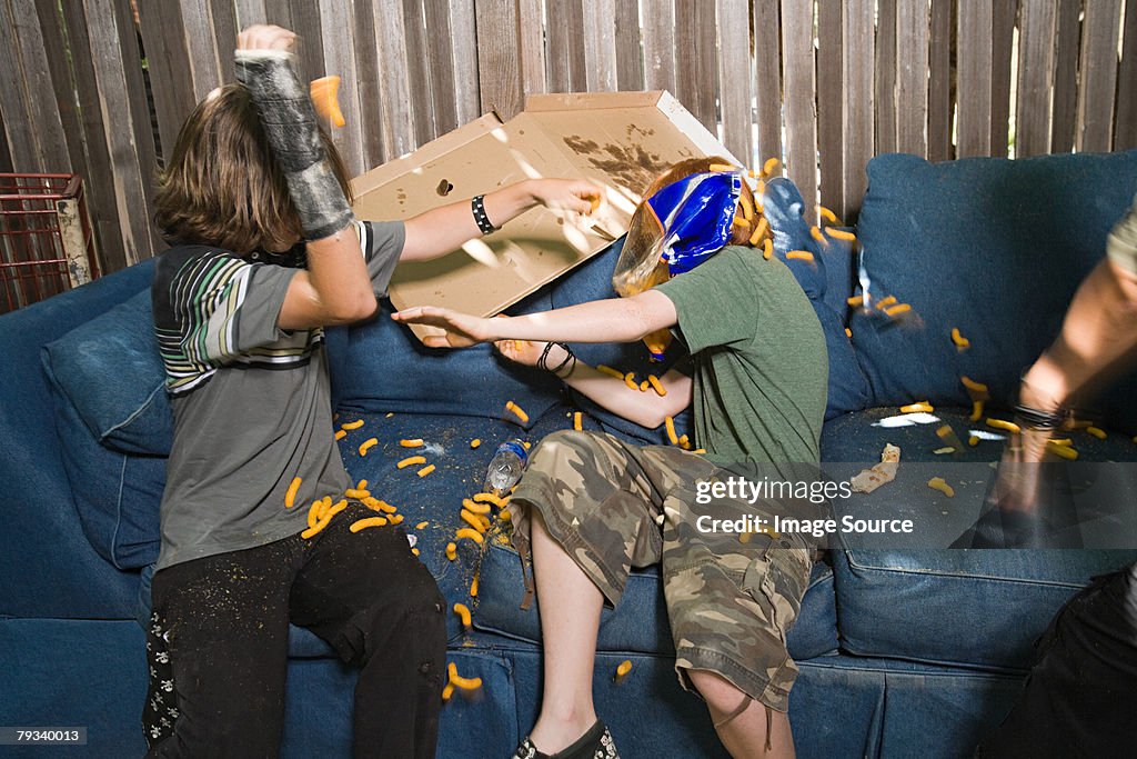 Boys having a food fight