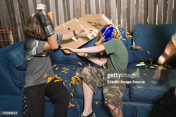 boys having a food fight - food fight stock pictures, royalty-free photos & images