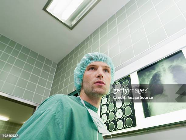 a surgeon in an operating theatre - radiogram photographic image stock-fotos und bilder