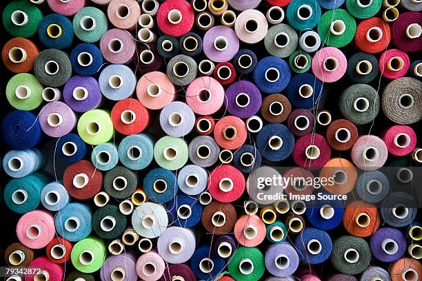 pile of cotton reels - thread stock pictures, royalty-free photos & images