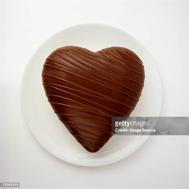 a chocolate heart - heart candy on white stock-fotos und bilder