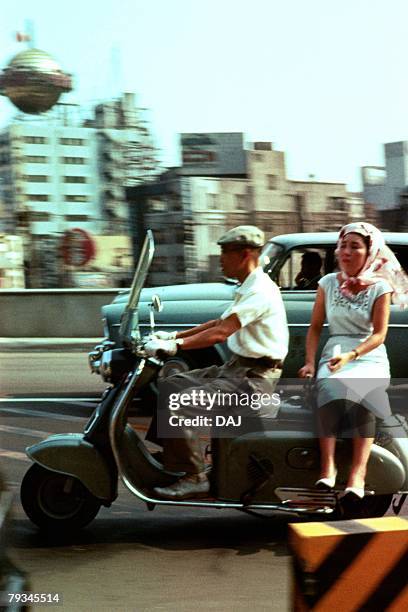 man and woman on scooter - showa period fotografías e imágenes de stock