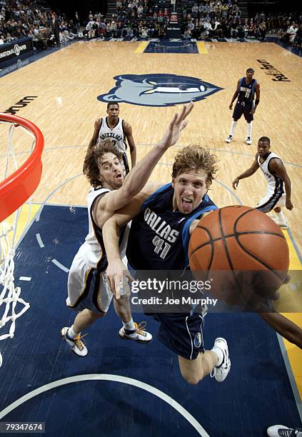 Dirk Nowitzki of the Dallas Mavericks shoots a layup past Pau Gasol of the Memphis Grizzlies on January 28, 2008 at the FedExForum in Memphis,...