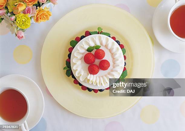 strawberry cake and cups of tea on table - strawberry and cream stock pictures, royalty-free photos & images