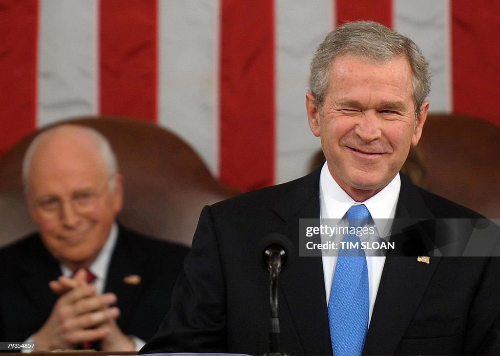 US President George W. Bush winks to a m
