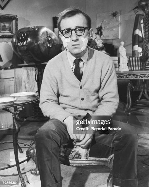 American actor, writer, comedian and director Woody Allen with surgical dressings on each cheek, 1965. He is in Paris to film 'What's New, Pussycat',...
