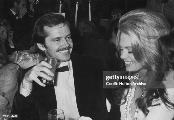 American actor Jack Nicholson with actress Dyan Cannon at a party, circa 1975.