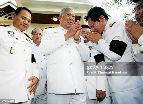 Samak Sundaravej greets People's Power Party members after receiving the royal command, appointing him as Thailand's new prime minister, at his...