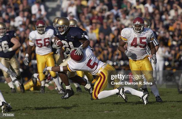 Javin Hunter of the Notre Dame University Fighting Irish fights off DeShaun Hill of USC Trojans during the game on October 20,2001 at Notre Dame...