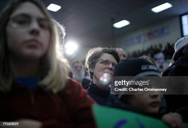 Supporters of Democratic presidential hopeful Sen. Barack Obama listen as he addresses a rally in the gymnasium of Stevens High School on January 6,...