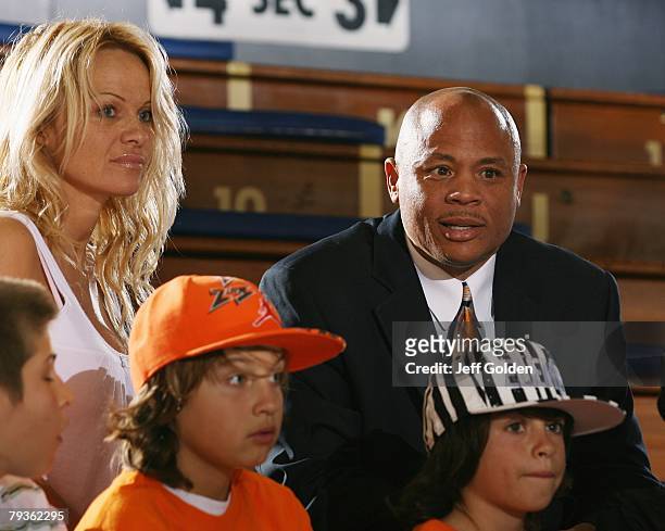 Actress Pamela Anderson sits with her sons Brandon Thomas Lee and Dylan Jagger Lee and Maurice Hilliard, Academic Support Coordinator for Pepperdine...