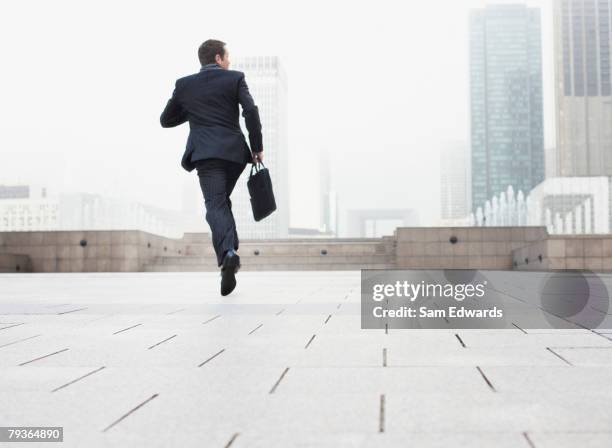 businessman outdoors jumping - businessman running stock pictures, royalty-free photos & images