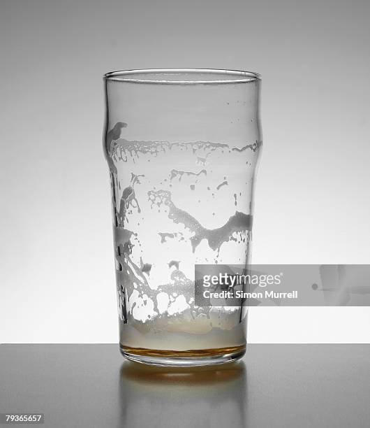 empty glass of beer indoors - empty beer glass stock pictures, royalty-free photos & images