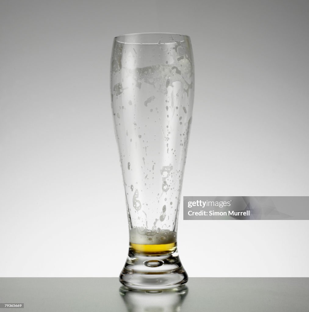 Empty glass of beer indoors