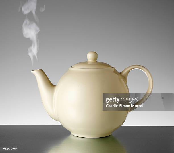 tea kettle with steam indoors - tea pot stock pictures, royalty-free photos & images