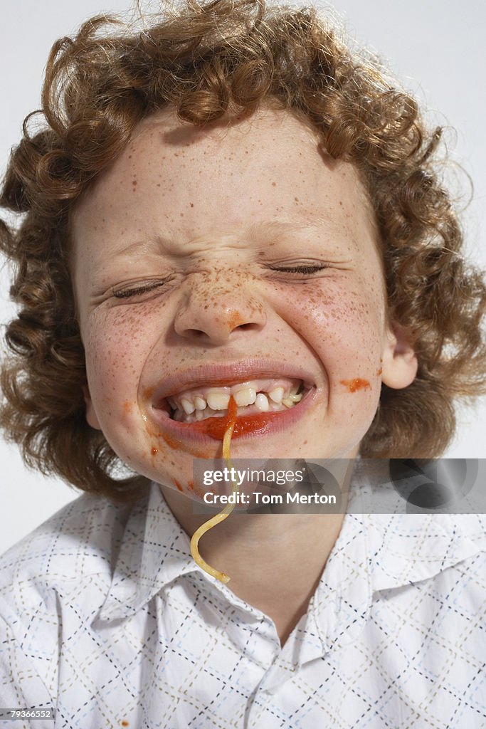 Young boy interior comer spaghetti