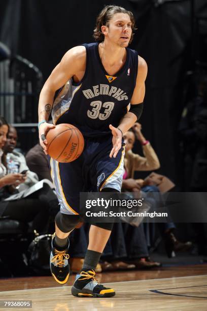 Mike Miller of the Memphis Grizzlies dribbles the ball up court against the Atlanta Hawks during the game on December 8, 2007 at Philips Arena in...