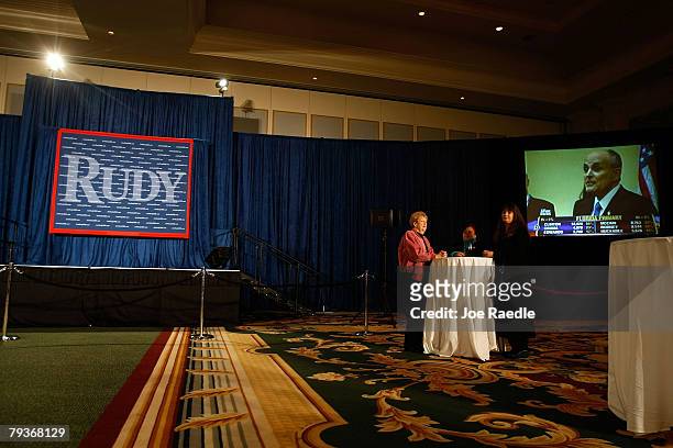Jerry Buchanan, Nancy Acevedo and Debra Baril stand at a table together as they attend the primary night party for Republican presidential hopeful...