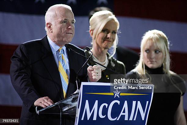 Republican presidential hopeful Sen. John McCain speaks as his wife Cindy and daughter Megan look on during a post primary campaign rally at the...