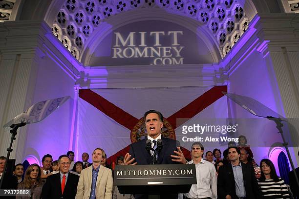 Republican presidential hopeful and former Massachusetts Gov. Mitt Romney pauses as he speaks while his sons Ben and Josh look on during a post...