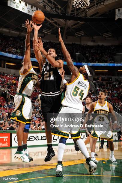 Tim Duncan of the San Antonio Spurs goes to the basket against Nick Collison and Chris Wilcox of the Seattle SuperSonics on January 29, 2008 at Key...